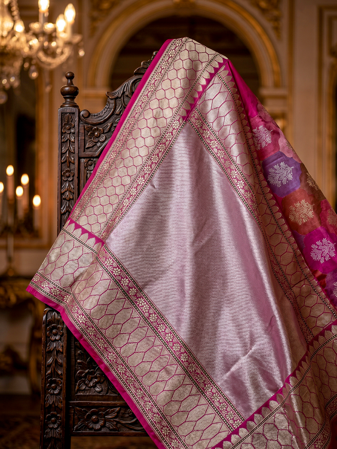 A buyer inspecting the authenticity of a handloom Banarasi saree